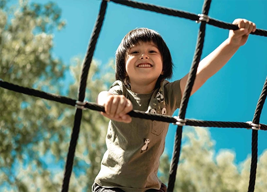 Living room with orange sofa and wooden partition